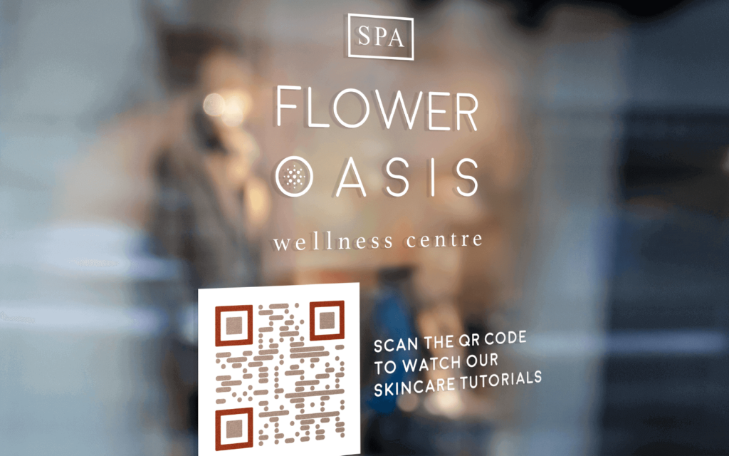 A door sign at a wellness studio uses a QR Code to connect passersby with digital content