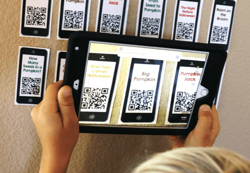 A child scanning QR Codes with an iPad