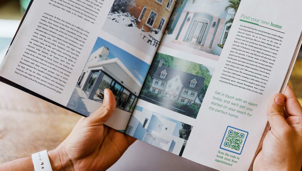 A real-estate brochure with a Business Page QR Code in the bottom right corner prompting readers to scan and book an appointment