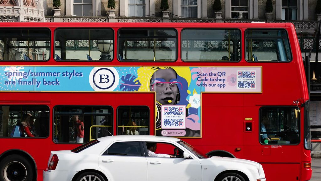 A boutique's App QR Code on a bus prompts people to scan to shop with their app